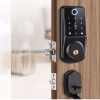 smart fingerprint keypad deadbolt installed on a wooden entry door