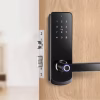 fingerprint handle keypad smart lock installed on wooden entry door