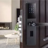 fingerprint handle keypad smart lock installed on a residential entry door