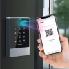 QR access controller scanning a QR code from a smartphone at a building entrance